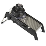 A black mandoline slicer on a white background, designed for kitchen use.