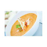 Tortilla soup with filling on a white bowl