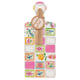 Decorative bottle opener with colorful designs on a white background