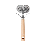 A pastry cutter with a wooden handle and two metal cutting wheels.