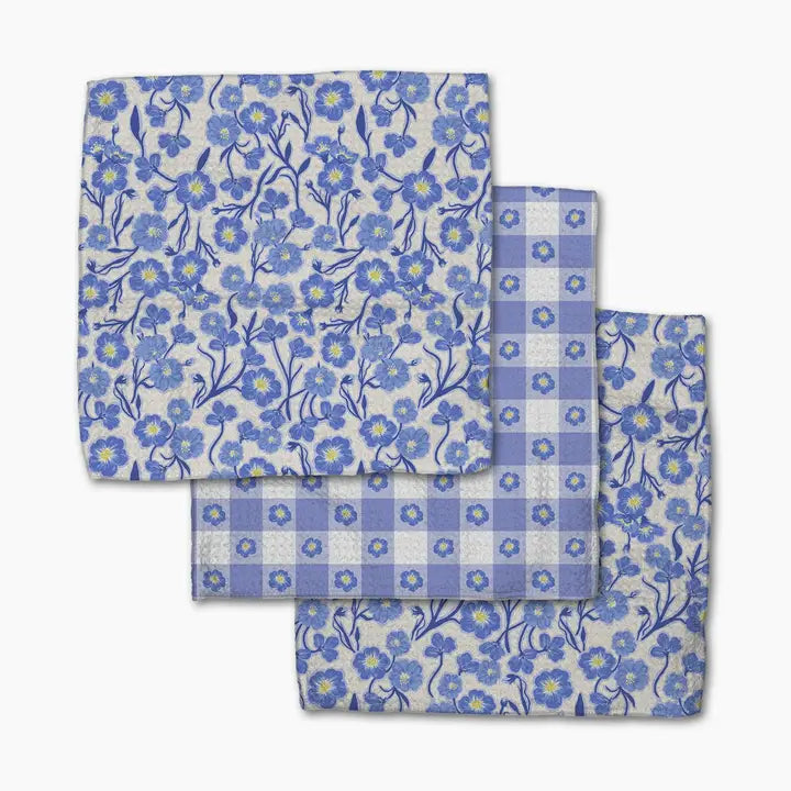Set of blue floral and checkered fabric swatches on a white background