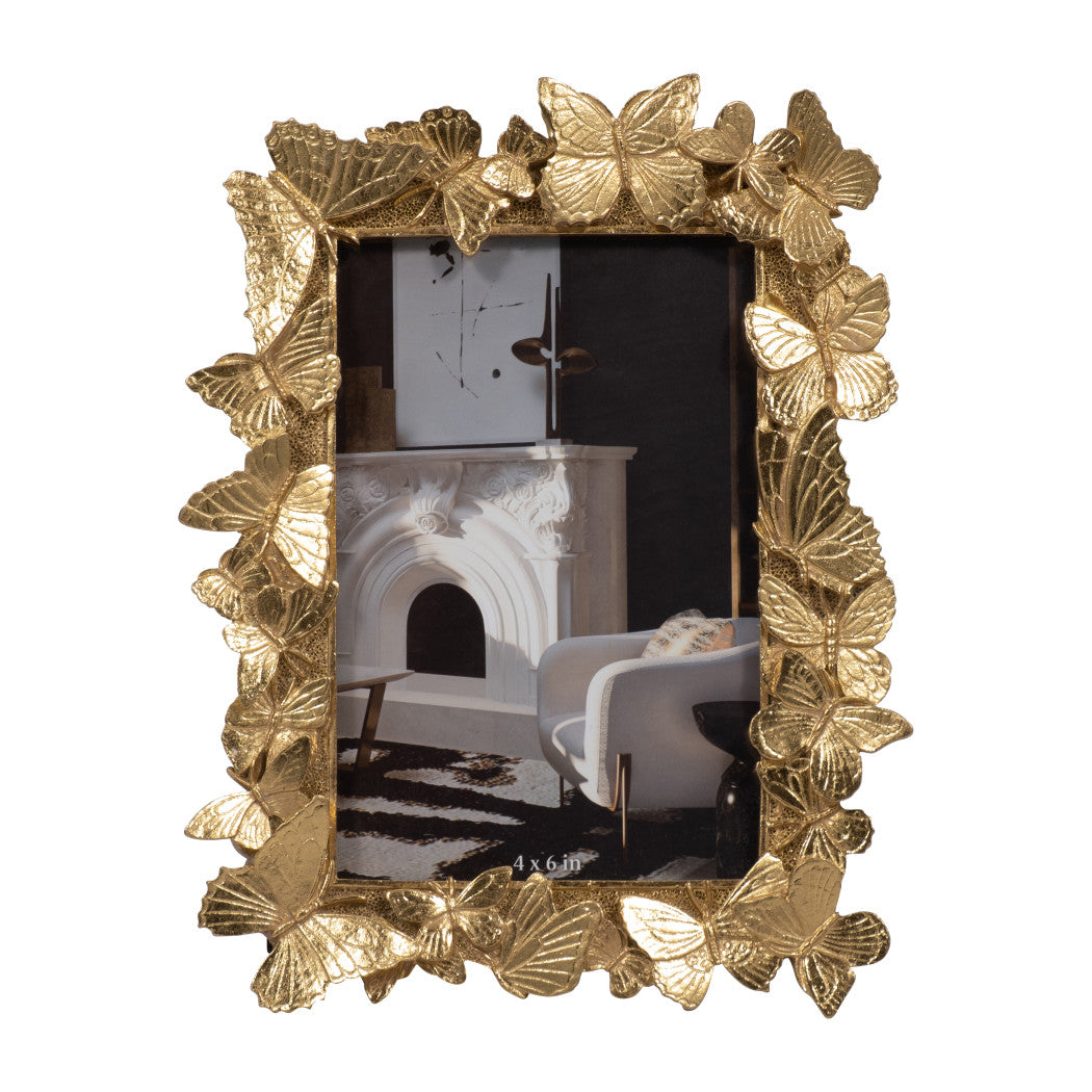 Decorative gold frame with butterfly design on a white background