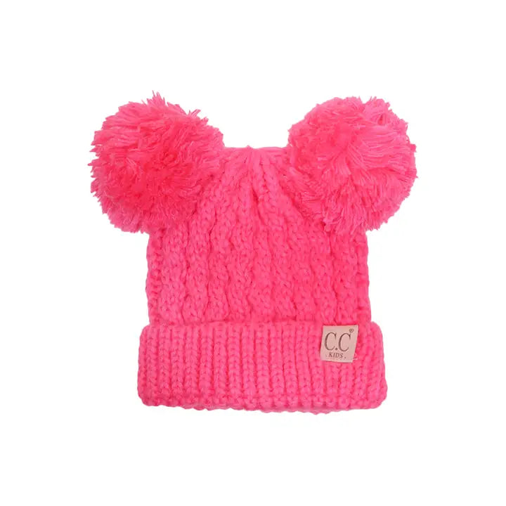 Pink knit beanie with two large pom-poms on a white background