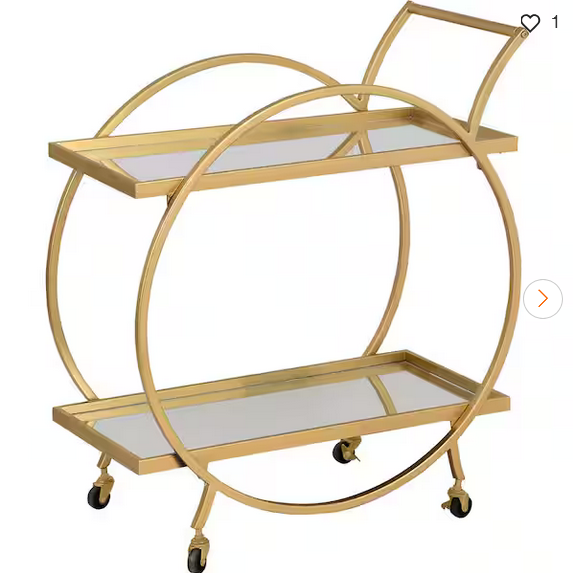 A gold-colored metal retail cart with mirrored shelves and wheels for mobility.