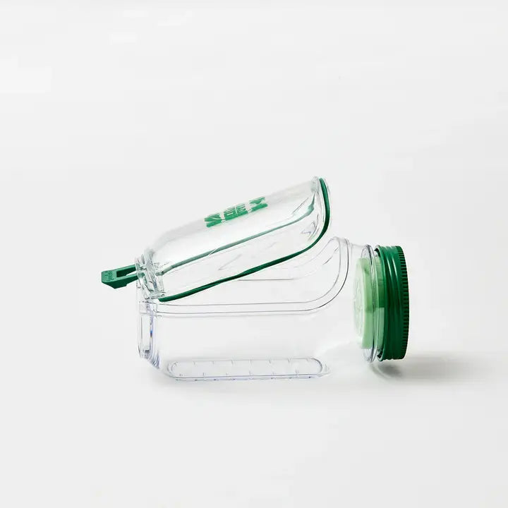 Clear plastic container with green lid on a white background