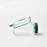 Clear plastic container with green lid on a white background