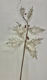 A metallic holly leaf spray with silver leaves and red berries on a brown stem, likely a decorative holiday ornament.