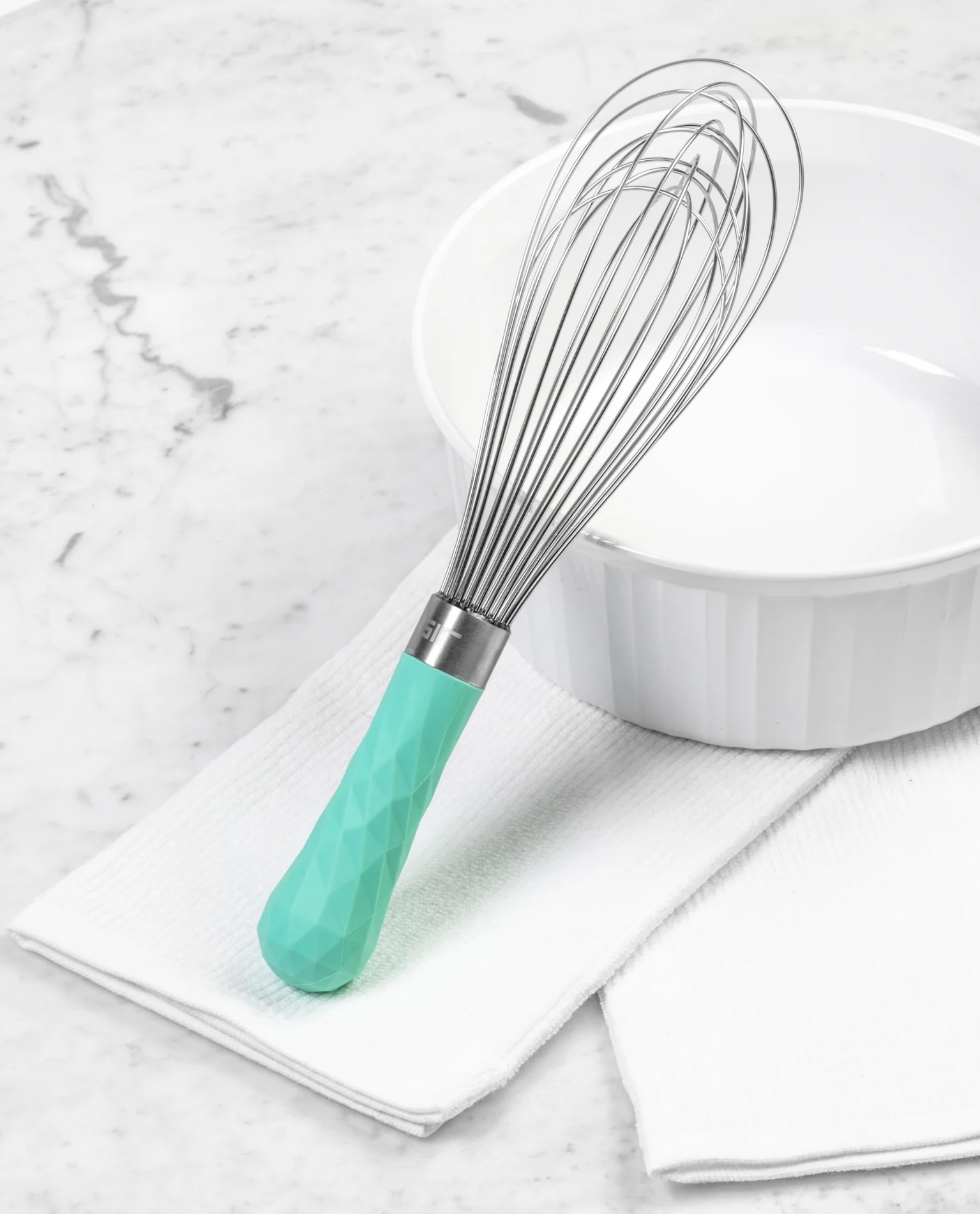 whisk with mint green handle