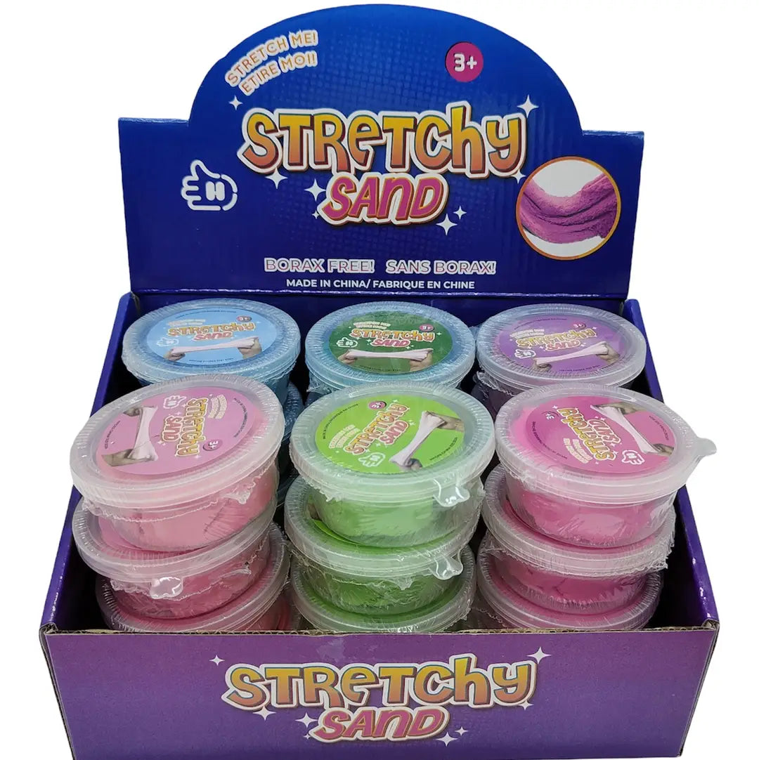 Display box of Stretchy Sand with multiple containers in various colors.