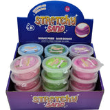Display box of Stretchy Sand with multiple containers in various colors.