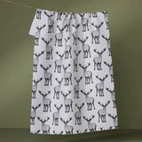 Patterned towel with deer design on a green background