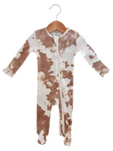 Baby onesie with brown and white tie-dye pattern on a hanger against a white background
