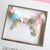 Charm bracelet with colorful beads and charms on a white card