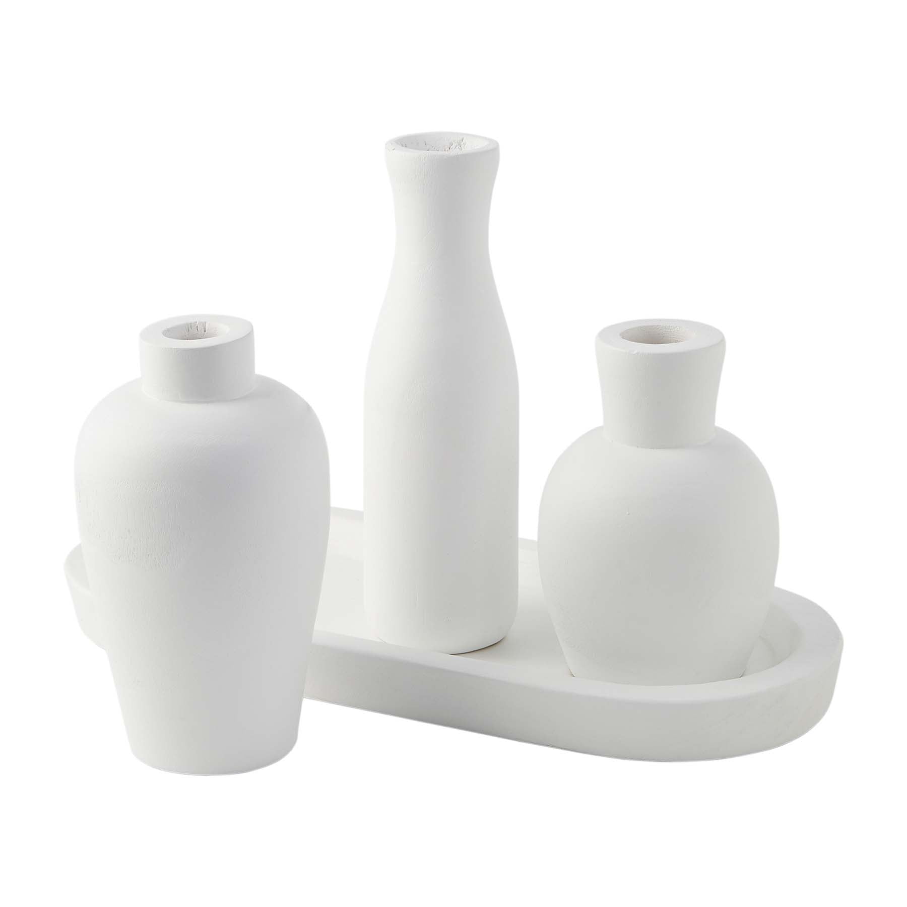 three white vases on a base