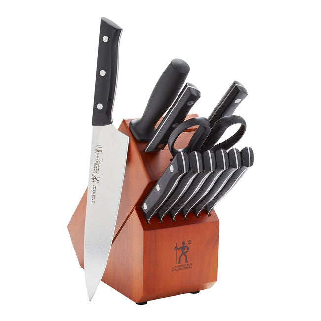 A set of Henckles kitchen knives with a wooden block sheath.