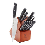 A set of Henckles kitchen knives with a wooden block sheath.