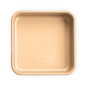 A beige square cake pan made of aluminum.