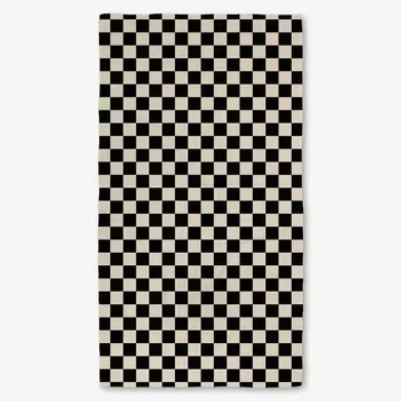 A black and white checkered bath towel laid flat.