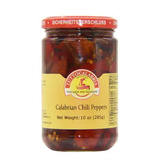 A jar of Calabrian Chili Peppers, with visible whole red and yellow chili peppers inside the jar, sealed with a red safety seal.
