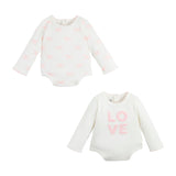 Two white bodysuits for babies, one with a bow print and one with the word 'LOVE' printed on the front, both in pink.