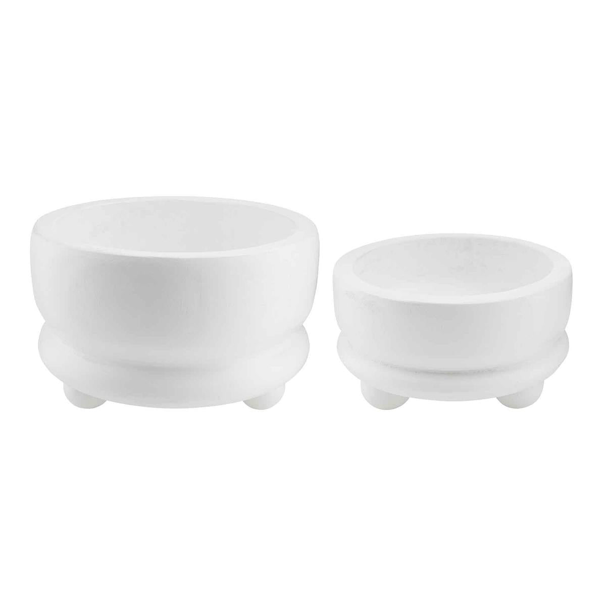 Two white footed decorative bowls of different sizes with a minimalistic design.