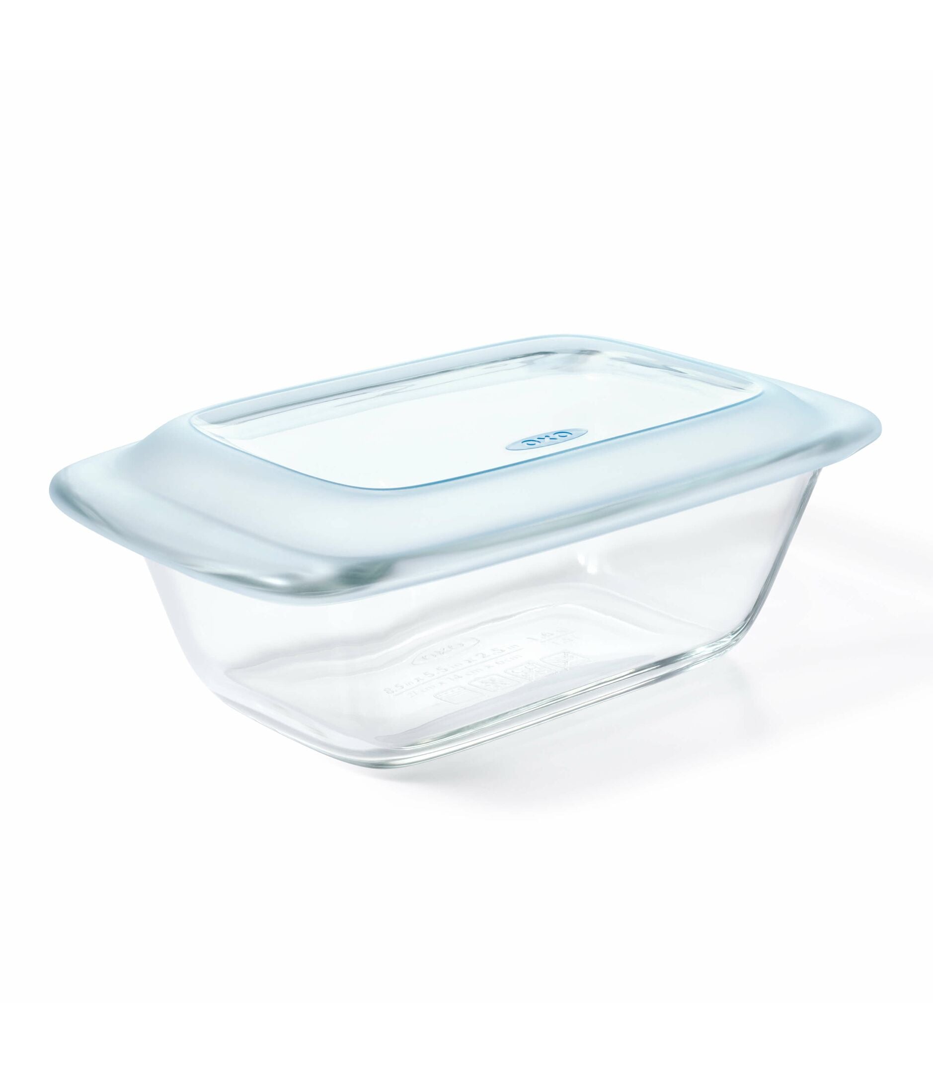 Clear glass food container with a blue lid on a white background