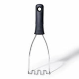 Masher with black handle on a white background