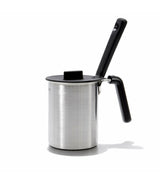 Stainless steel milk frother with black handle on a white background