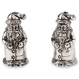 This image features a charming set of Santa salt and pepper shakers. Each shaker is intricately designed to resemble a jolly Santa Claus, complete with a festive hat adorned with a star and a flowing white beard.