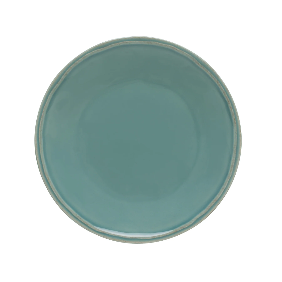 A round, teal blue salad plate with a green rim.