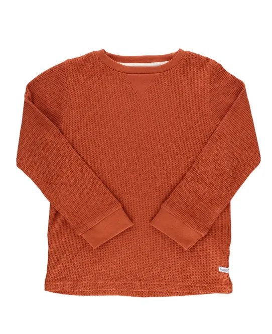 A burnt sienna colored waffle knit long-sleeved boy shirt.