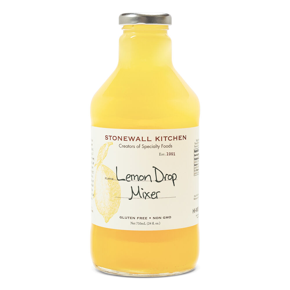 A bottle of Stonewall Kitchen Lemon Drop Mixer with a yellow liquid visible through the transparent glass.