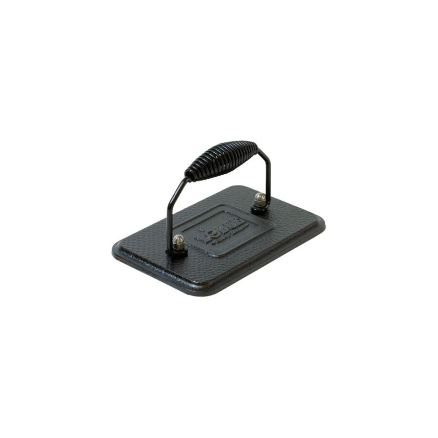 A black cast iron grill press with a handle.