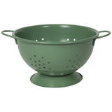 A green metal mixing bowl with two handles and numerous small holes for draining.