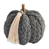A plush grey braided pumpkin with a beige tassel, suitable for fall and Halloween decorations.