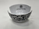 A black and white floral patterned sponge holder