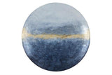 A round metal wall art with a blue and gold color scheme.