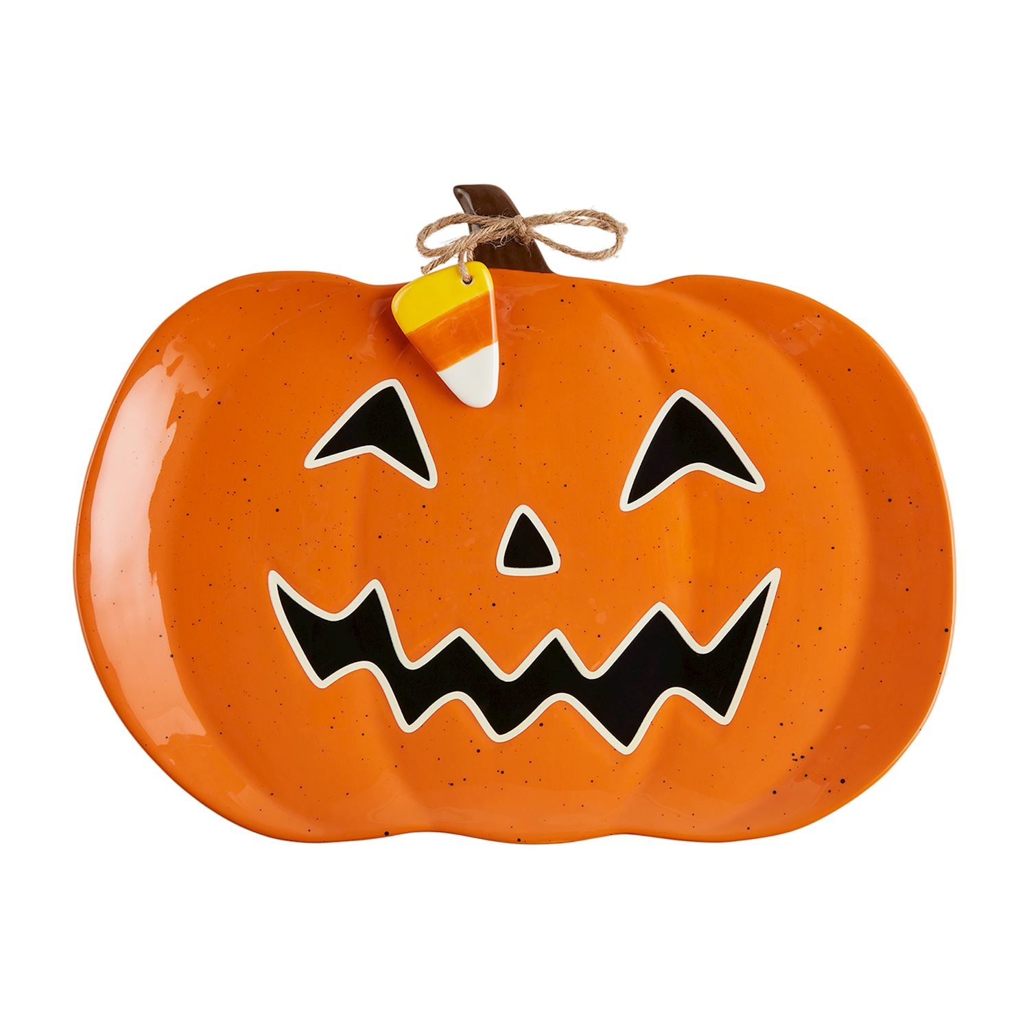 An orange pumpkin-shaped platter with a glow-in-the-dark jack-o-lantern face design, complete with black eyes and mouth, and a string bow attached to a handle.