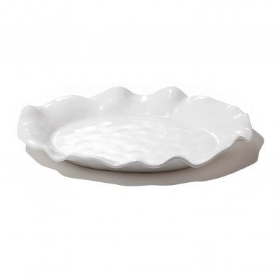 An oval white platter with a textured edge and a shiny opalescent surface, designed by Beatriz Ball.