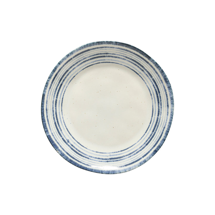 A ceramic cereal bowl with a blue and white rimmed design on a white background.