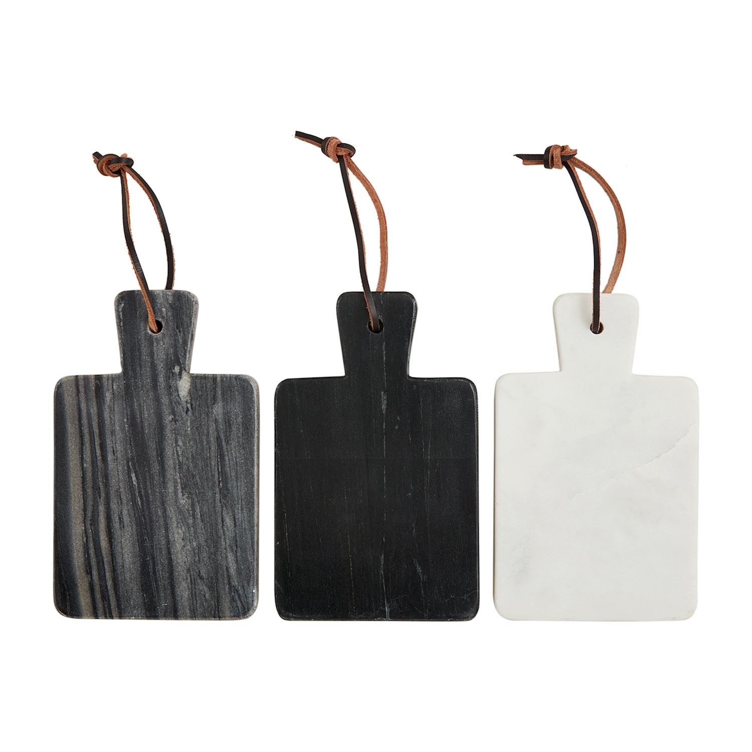 Three mini marble cutting boards with leather straps for hanging, two are black and one is white.