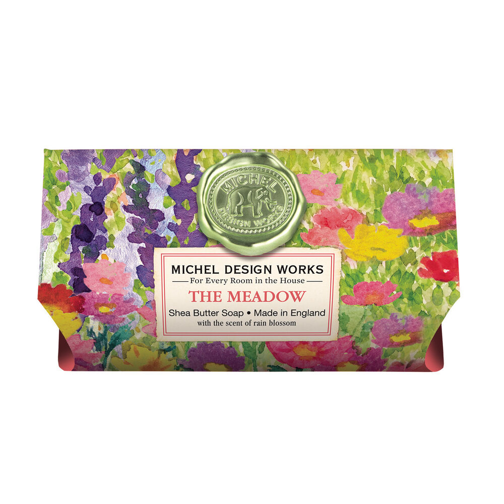 Packaged bath soap with a floral design and a gold seal at the top, labeled 'The Meadow'.