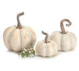 A set of three ivory resin pumpkins with varying sizes, displayed on a neutral background.