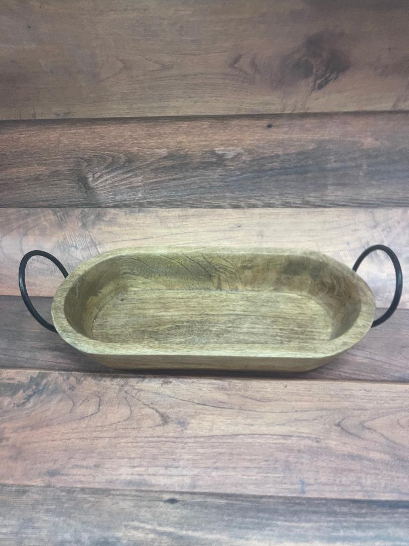 A rectangular mango wood tray with two metal handles attached to the sides, displayed on a wooden surface.