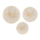 Three round woven wall art pieces with a geometric pattern and a golden-brown color in the center.
