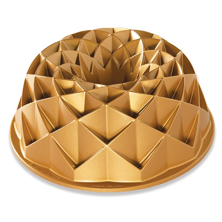 A gold-colored bundt pan with a geometric diamond pattern.