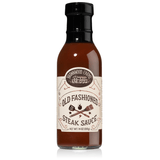 A bottle of old fashioned steak sauce with a label that includes crossed steak knives and the text 'OLD FASHIONED STEAK SAUCE'.