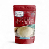 A stand-up pouch of Marie Rose Blue Ribbon Pie Crust on a clean white background. The packaging is primarily dark red with white text and a photo of a flaky pie crust on the front.