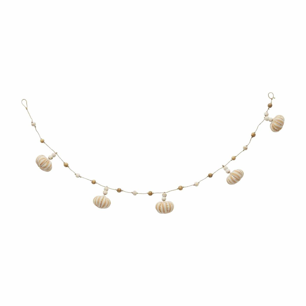 A garland featuring a series of striped pumpkins strung along a neutral colored cord.