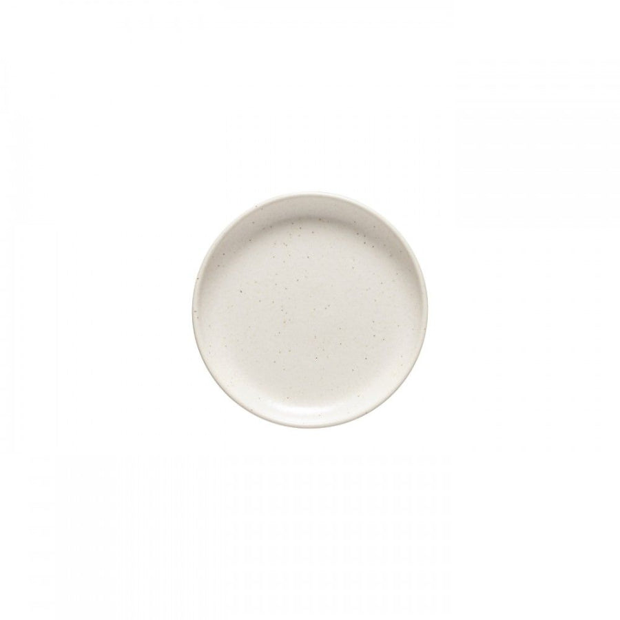A white ceramic bread plate with a textured edge.
